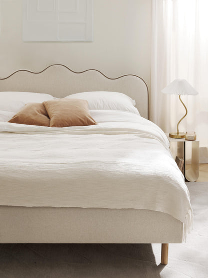 Romatta Upholstered Bed with Wavy Headboard